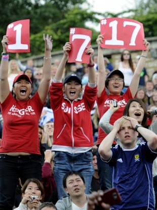An Andy Murray fan (in the Scotland shirt) isn't thrilled to be reminded of Roger Federer's ranking, Wimbledon record, and overall Grand Slam record.