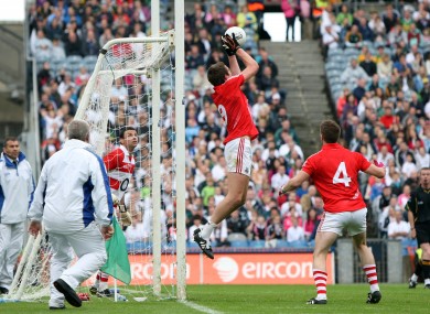 Cork's Aidan Walsh gathers a free that drops short of the crossbar in Sunday's clash with Kildare.