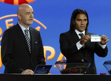 UEFA general secretary Gianni Infantino, left, and Atletico Madrid's Radamel Falcao at this morning's draw in Monaco.