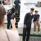 A Sailor from the 'Cuauhtemoc' a Mexican Tall Ship poses for a photo with a young visitor. (Julien Behal/PA Wire)