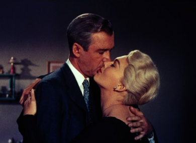 James Stewart and Kim Novak kiss in Alfred Hitchcock's 'Vertigo'.