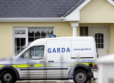 Gardaà outside the house in Harrison Place, Charleville, Co Cork on Monday.