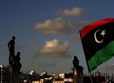 Libyans watch the protest against Ansar al-Shariah Brigades and other Islamic militias, in Benghazi.