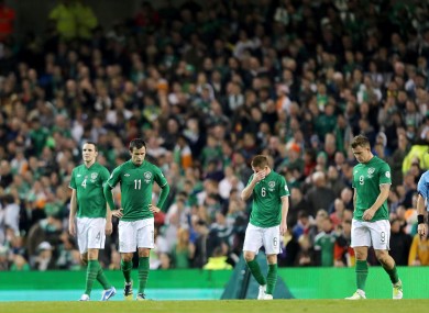 The Irish players looking dejected.