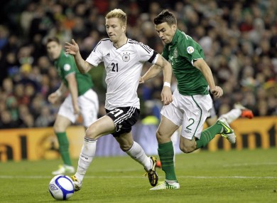 Germany's Marco Reus runs past Republic of Ireland's Seamus Coleman.