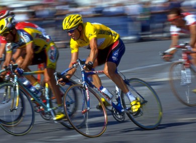 Lance Armstrong in Paris in 1999, about to claim his first Tour de France. An Irish aide states in an affidavit that she bought concealer so that Armstrong could cover a bruise on his arm, caused by a syringe, days before the race began.
