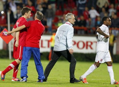 Serbian player Milos Ninkovic, left, and England player Danny Rose, right, react during their 2013 UEFA European Under-21 Championship play-off.