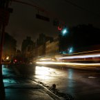 Cars pass through a darkened neighborhood on the west side of Manhattan on Monday in New York. Much of New York was plunged into darkness Monday by a superstorm that overflowed the city's historic waterfront, flooded the financial district and subway tunnels and cut power to hundreds of thousands of people. (AP Photo/Peter Morgan)