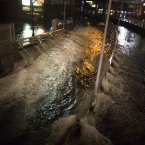 Sea water floods the entrance to the Brooklyn Battery Tunnel on Monday, in New York. Sandy continued on its path Monday, as the storm forced the shutdown of mass transit, schools and financial markets, sending coastal residents fleeing, and threatening a dangerous mix of high winds and soaking rain. (AP Photo/ John Minchillo)