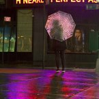 A lone pedestrian looks up towards an electronic message about superstorm Sandy in New York's Times Square, early today. For New York City, Sandy was not the days-long onslaught many had feared, and the wind and rain that sent water sloshing into Manhattan from three sides began dying down within hours. Still, the power was out for hundreds of thousands of New Yorkers and an estimated 6.2 million people altogether across the East. (AP Photo/CX Matiash)