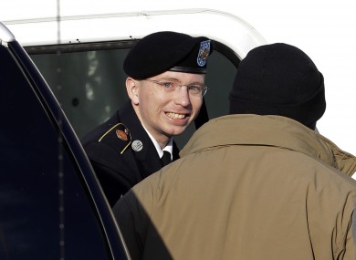 Bradley Manning steps out of a security vehicle as he is escorted into the courthouse.