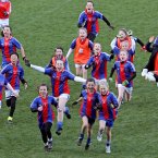 Players from Gaelscoil Chnoc Liamhna celebrate beating St Oliver Plunkett's Malahide.