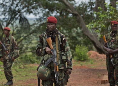 Troops from the Central African Republic stand guard at a building used for joint meetings between them and U.S. Army special forces, in Obo, Central African Republic