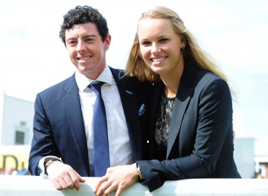 No rush: Rory McIlroy and Caroline Wozniacki. (File picture)