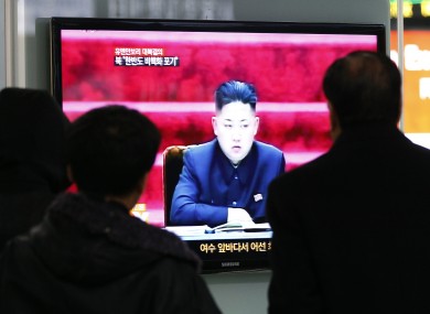 People watch TV showing North Korean leader Kim Jong Un at Seoul Railway Station in Seoul