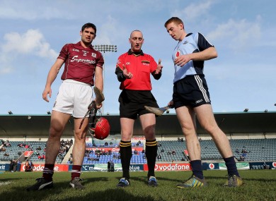 Dublin's John McCaffrey and Fergal Moore of Galway at the coin toss