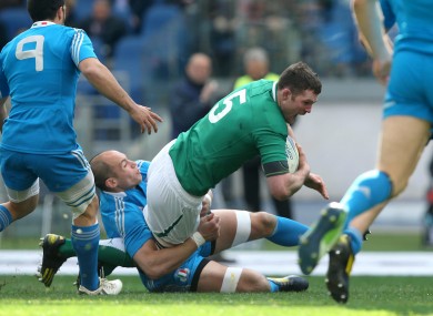 Ireland's Donnacha Ryan tackled by Italy's Sergio Parisse.