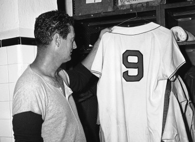 Ted Williams, Boston Red Sox slugger, hangs up his shirt with No 9 on it for the last time