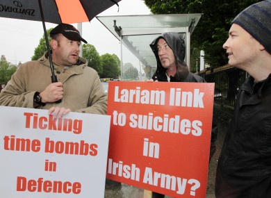 Ex soldiers Trevor Delaney and Paddy Gilford with MEP Paul Murphy protesting about outside the Burlington Hotel in Dublin last June.