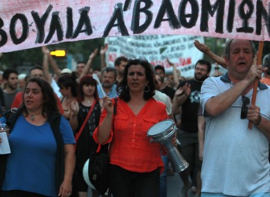 Protesters shout slogans during a protest in solidarity to the employees of Greek state broadcaster, ERT, in Thessaloniki.
