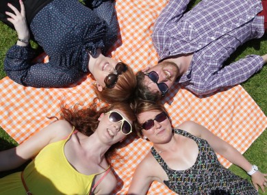 Pictured, clockwise from bottom right, Laura Farrell, Hilary Hughes, Aisling Cronin and Aaron Corr soak up the sun today in Merrion Square, Dublin, 9 July 2013