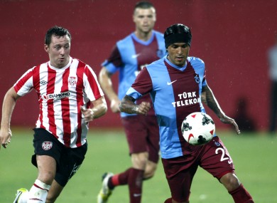 Trabzonspor's Gustavo Colman and Derry's Patrick Kavanagh.