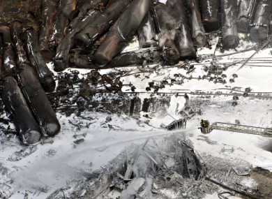 Firefighters watering the smouldering rubble last Sunday