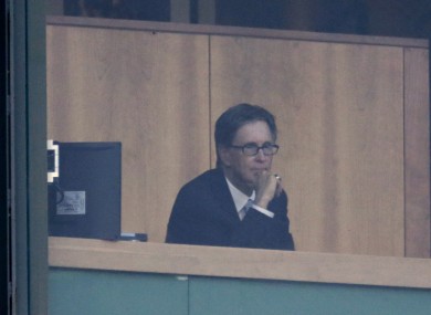 Boston Red Sox majority owner John Henry watches a baseball game at Fenway Park last weekend.