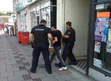 A suspected visa overstayer is arrested at a nail bar in Swansea, Wales