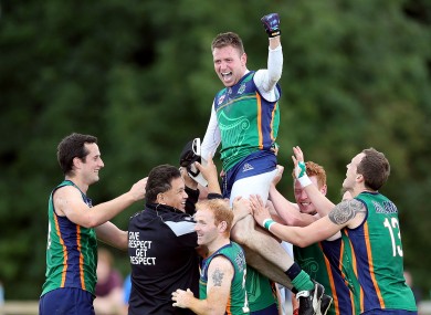 Warriors' Mark Leavy celebrates with teammates after the game.