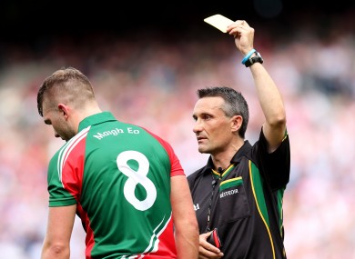 Referee Maurice Deegan yellow cards Aidan O'Shea yesterday in Croke Park.