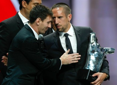 Lionel Messi congratulates Franck Ribery on his European Player of 2012/13 award.