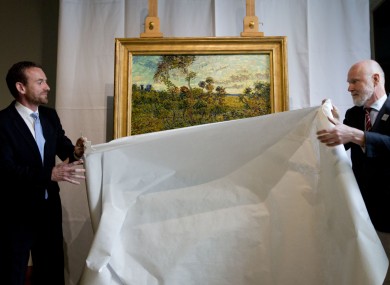 Axel Ruger and Louis van Tilborgh unveil the painting this morning.