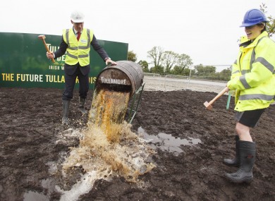Minister for Agriculture Simon Coveney breaks a cask of Tullamore Dew with William Grant & Sons Global CEO Stella David.