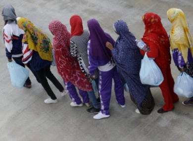 Migrants waiting to board a ferry boat after last months Lampedusa sinking