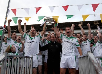 Moorefield's Kevin Murnaghan and Ross Glavin lift the trophy.