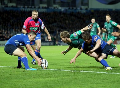 Kieran Marmion of Connacht beats Leinster's Eoin Reddan to score a try.