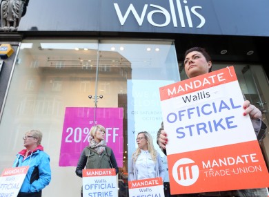 Wallis worker Melannie Rooney on strike stands outside the Wallis Shop on Grafton street