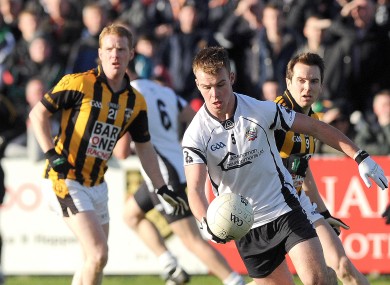 Kilcoo's Darragh O'Hanlon and Crossmaglen's Tony Kernan.